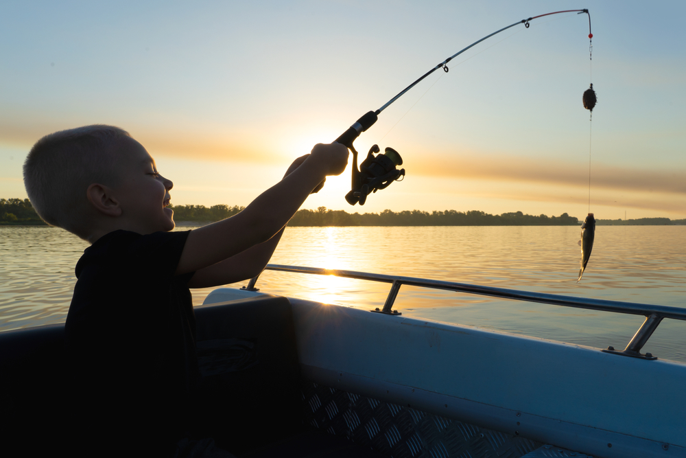 Young boy Fishing on a New FIshing Boat